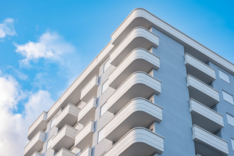 Multistory new modern apartment building. Stylish living block of flats.